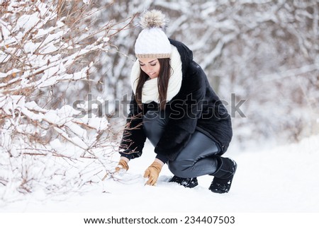Winter woman in snow outside in nature. Portrait closeup outdoors in snow.