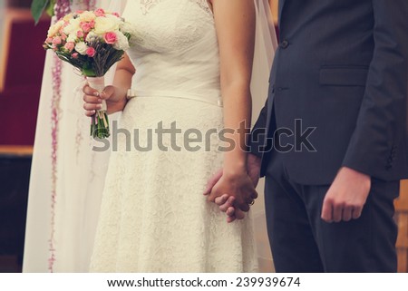 Bride and groom in church wedding ceremony