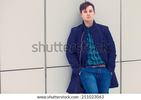 Young urban businessman in street