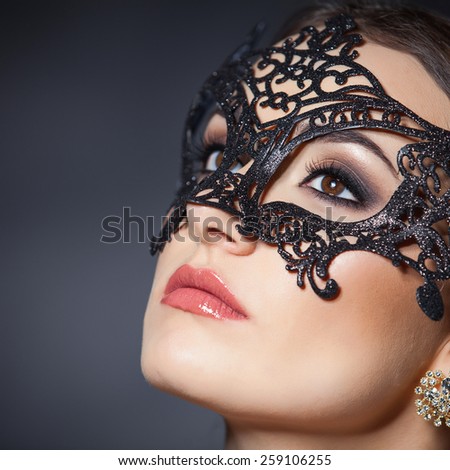 fashion portrait of sensual woman with mask on face