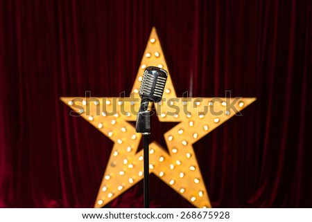 Retro microphone against star background