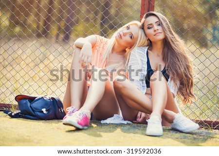 young woman and her best friend having fun together outside