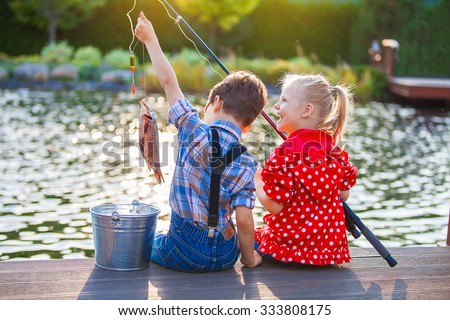 Image, Stock Photo child holding a fish and showing it to the camera