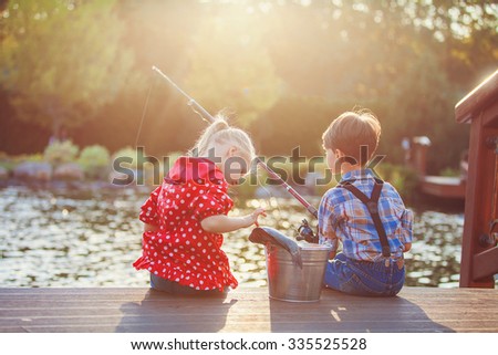 Similar – Image, Stock Photo Children playing with fishing rod toy in a pool in a home garden