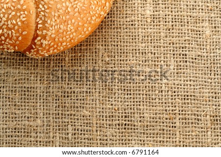 Croissant with sesame on a sacking background