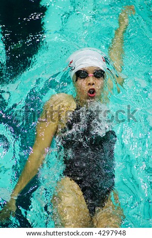 swimmer floats under water on a back after turn