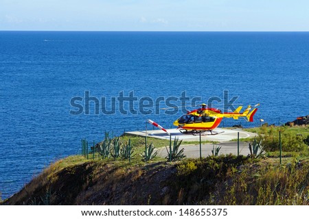 Helicopter on a landing area with Mediterranean sea in background,Vermilion Coast, Roussillon, France