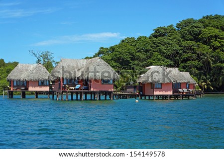 Eco resort with thatched cabins above the sea on the tropical island of Bastimentos, Caribbean sea, Bocas del Toro, Panama