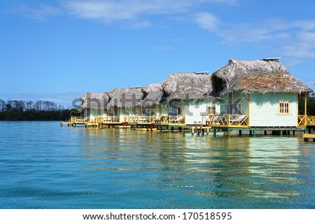 Tropical eco resort with thatched cabins over the sea, Colon island, Caribbean sea, Bocas del Toro, Panama