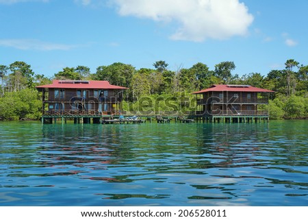 tropical hotel on stilts over water, Caribbean sea, Panama