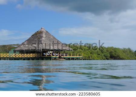 Caribbean restaurant over water with thatched roof, Bocas del Toro, Central America, Panama