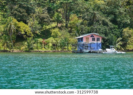 Waterfront property on the Caribbean coast of Panama with tropical home overwater, Bocas del Toro, Central America