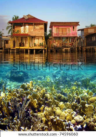 Split view with tropical houses over water and coral reef fish underwater, Caribbean sea, Panama