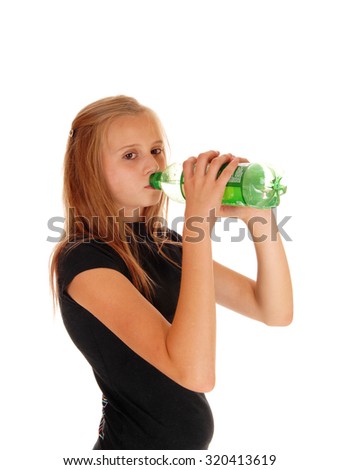 A young girl in a black t-shirt drinking pop out of a green bottle,\
isolated for white background.