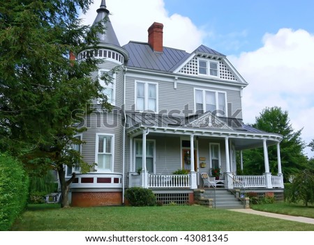 A beautiful old Victorian mansion on a big lot and a nice porch.