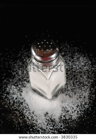 top view of salt shaker with spilled salt