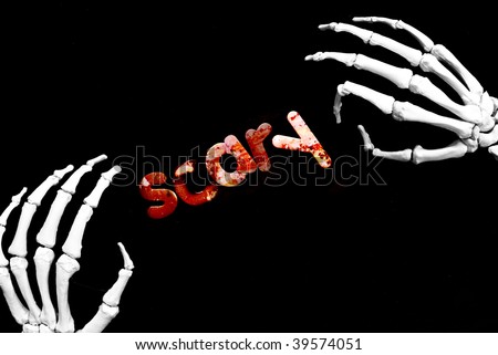 skeletal hands framing the word scary