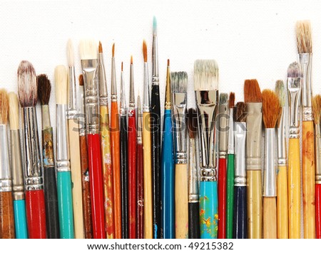 Row Of Artists' Paintbrushes Against Natural Canvas Stock Photo ...