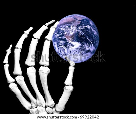 skeleton hand holding the planet earth, isolated on black. Planet earth source photo from NASA/courtesy of NASAimages.org