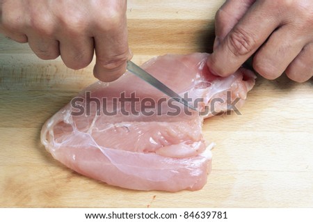 Taking the fat and nerves out of the chicken breast
