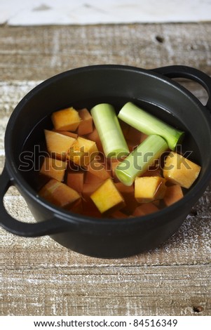 Cooking the diced pumpkin and leeks in boiling water