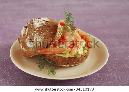 Scrambled egg and shrimp individual brown bread loaf sandwich