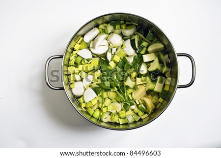 Leeks, zucchinis and turnips in a cooking pot