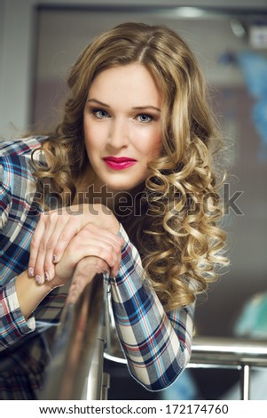 Beautiful woman with elegant hairstyle. Fashion photo