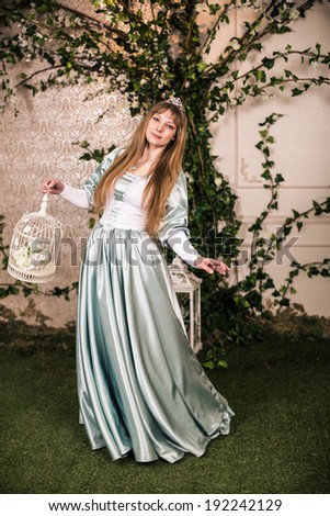 Photo of romantic woman in fairy garden