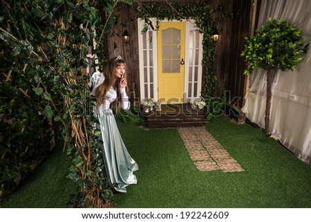 Photo of romantic woman in fairy garden