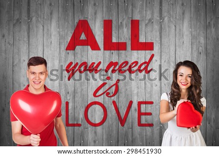 Beautiful man and woman on gray background with text all you need is love