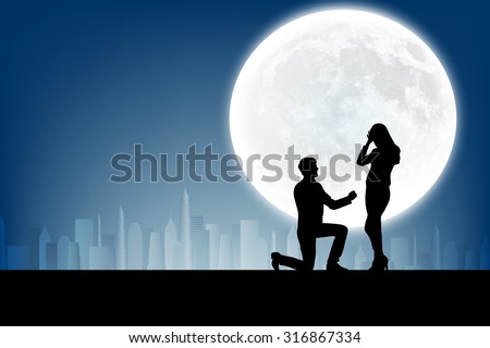 silhouette of man makes a proposal a silhouette woman on the full moon background