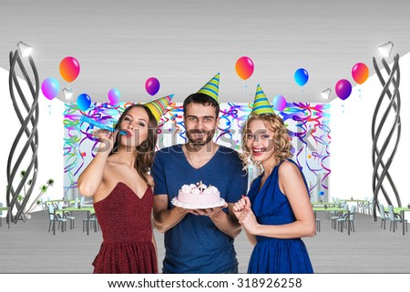 Young man is celebrating birthday with friends in a cafe