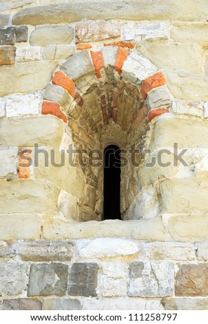 Italy. Romagna Apennines, San-Leo village medieval church window