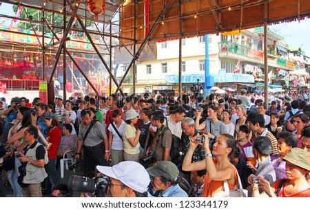 HONG KONG-MAY 24: Crowd of people at the Bun Festival in Cheung Chau. The festival draws thousands of local and overseas tourists every year. May 24, 2007 in Hong Kong.