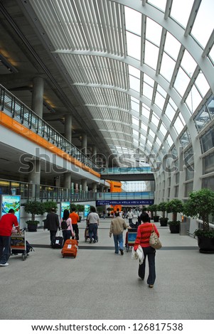 HONG KONG, CHINA - MAY 25:  Passengers exit the Hong Kong air terminal. The airport handles more than 55 million passengers per year. May 25, 2008 in Hong Kong, China
