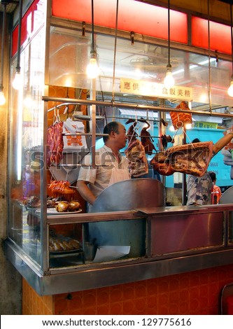 HONG KONG -Â?Â? NOVEMBER 18: Typical street restaurant.  With more than 12000 street stalls Hong Kong is one of the most vibrant food capitals in the world. November 18, 2005 in Hong Kong, China