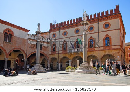 RAVENNA, ITALY MARCH 21: tourists walking in People square. The city defined by UNESCO heritage of humanity has 3 million tourists per year. March 21, 2013 Ravenna Italy