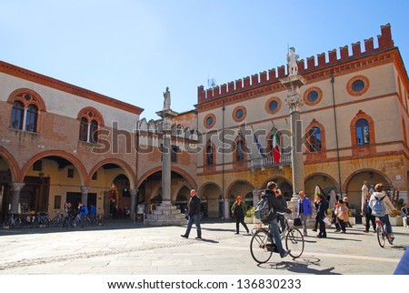 RAVENNA, ITALY MARCH 21: tourists walking in People square. The city defined by UNESCO heritage of humanity has 3 million tourists per year. March 21, 2013 Ravenna Italy
