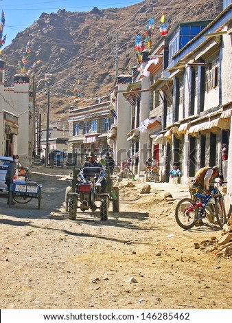 SHIGATSE, TIBET-NOVEMBER 16: locals approaching the Shigaste lamb market via a side road.   This is the more important market in the Shigatse Prefecture. November 16, 2004 Shigatse, Tibet