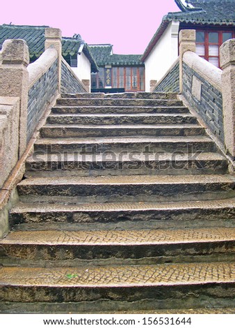 JINXI, SHANGHAI, CHINA  FEBRUARY 6: steps of a very old village bridge. The ancient village is a Shanghai tourist attraction with 100000 visitors per year. February 6, 2005, Jinxi, China
