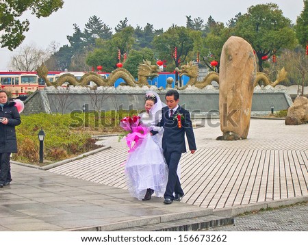 JINXI, SHANGHAI, CHINA Ã¢Â?Â? FEBRUARY 6: people getting married in the old village. The ancient village is a Shanghai tourist attraction with 100000 visitors per year. February 6, 2005, Jinxi, China