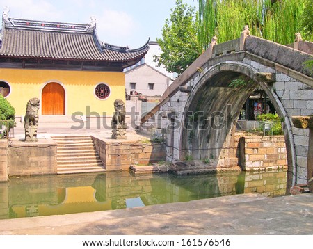 NANXUN, SHANGHAI, CHINA Ã¢Â?Â? AUGUST 28: village ancient bridge and Guanghuigong Taoist  temple. The Nanxun village is Shanghai tourist attraction with 100000 visitors year. August 28, 2004,Nanxun, China