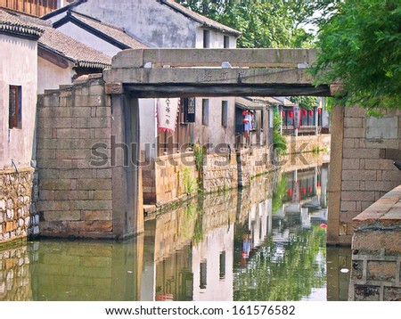 NANXUN, SHANGHAI, CHINA Ã¢Â?Â? AUGUST 28: reflection in a typical village canal. The Nanxun water village is Shanghai tourist attraction with 100000 visitors year. August 28, 2004,Nanxun, China