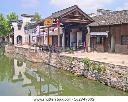 NANXUN, SHANGHAI, CHINA Ã¢Â?Â? AUGUST 28: life along the main village canal. The Nanxun water village is Shanghai tourist attraction with 100000 visitors year. August 28, 2004,Nanxun, China