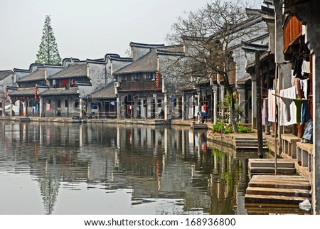 NANXUN, SHANGHAI, CHINA -Â?Â? APRIL 11: old houses along the main canal. The Nanxun water town is Shanghai tourist attraction with 100000 visitors year. April 11, 2007,Nanxun, China