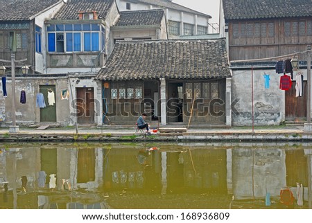 NANXUN, SHANGHAI, CHINA -Â?Â? APRIL 11: old house facade along the main canal. The Nanxun water town is Shanghai tourist attraction with 100000 visitors year. April 11, 2007,Nanxun, China