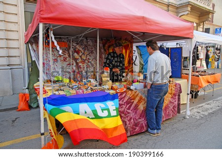 RUSSI, RAVENNA, ITALY- MARCH 30, 2014: cigarettes rolling paper vendor at the Seven Sorrows annual fair. The exhibition is very popular in the city and attracts thousands of people.