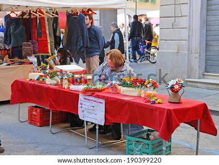 RUSSI, RAVENNA, ITALY- MARCH 30, 2014: fake flowers vendor at the Seven Sorrows annual fair. The exhibition is very popular in the city and attracts thousands of people.
