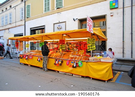 RUSSI, RAVENNA, ITALY- MARCH 30, 2014: sweets vendor at the Seven Sorrows annual fair. The exhibition is very popular in the city and attracts thousands of people.